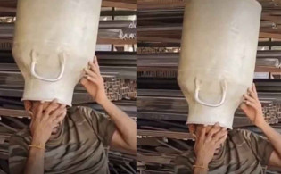 প্রচণ্ড গরম থেকে বাঁচতে দুধের ক্যান মাথায়—অবশেষে বিপাকে